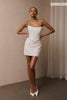 A woman wears a structured corset-style bodice and a short wedding skirt_XS_