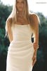 A woman wearing a strapless white wedding gown with a draped bodice and floor-length silhouette_xs_