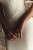 Close up of a woman wears a structured corset-style bodice and a long wedding skirt_XS_
