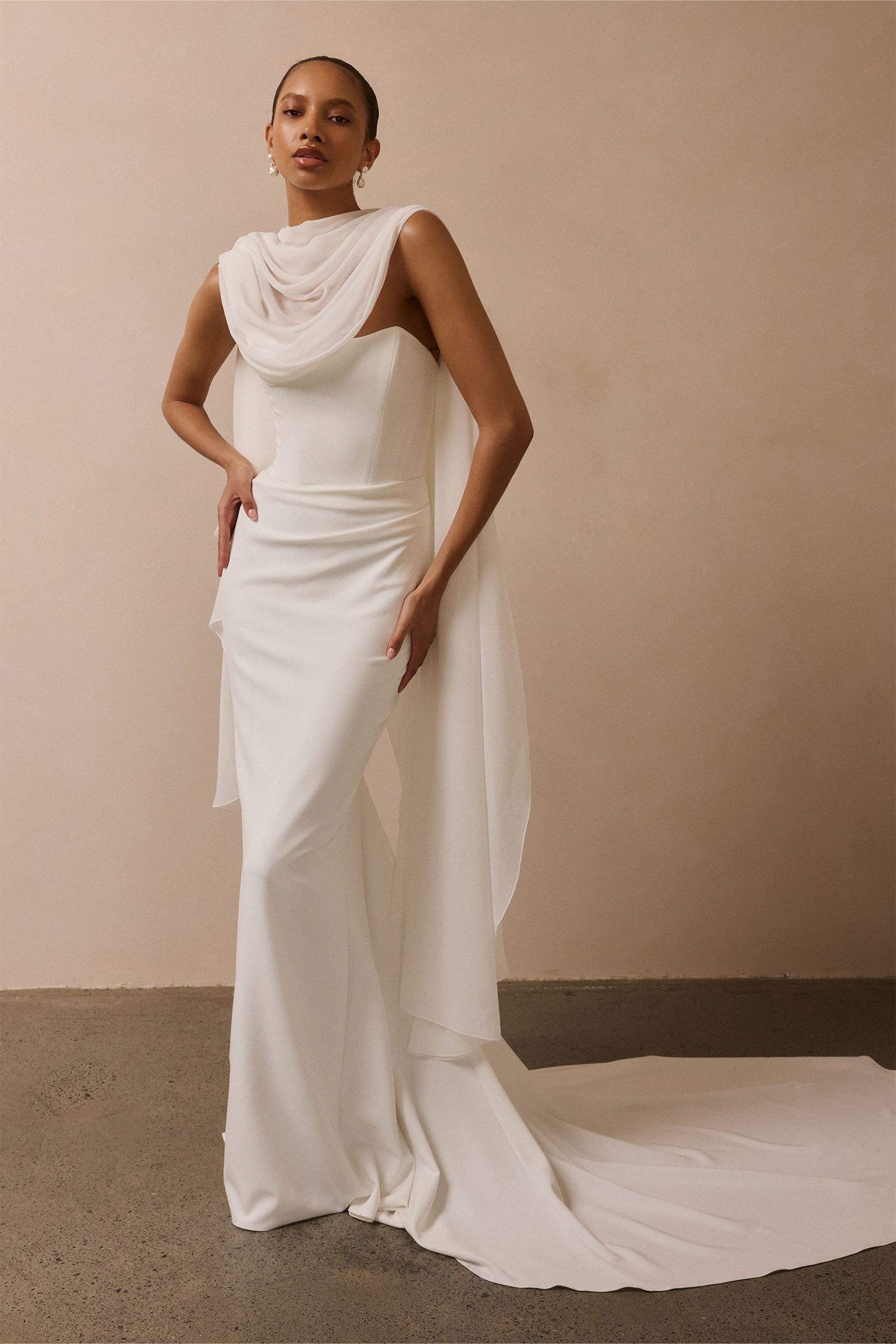 A woman wearing a strapless white mermaid style gown_XS_