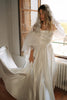 Mantilla Veil with Wedding Dress standing by a window