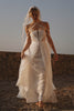 Woman in a lace wedding dress standing on a rocky landscape_XS_