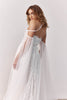 Woman wearing a lace wedding dress with sheer sleeves_XS_