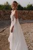 Woman in a lace wedding dress standing outdoors_XS_
