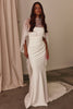Woman wearing a white wedding dress with a Chantilly lace shawl