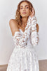 Woman wearing a lace wedding dress and gloves_XS_