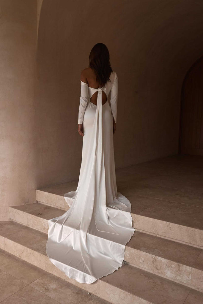 Back shot of the long sleeve Anu gown. Tie detailing at the back