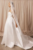 Bride wearing a lace mantilla veil and wedding dress