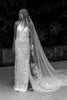 Woman in a floral wedding dress with a long veil