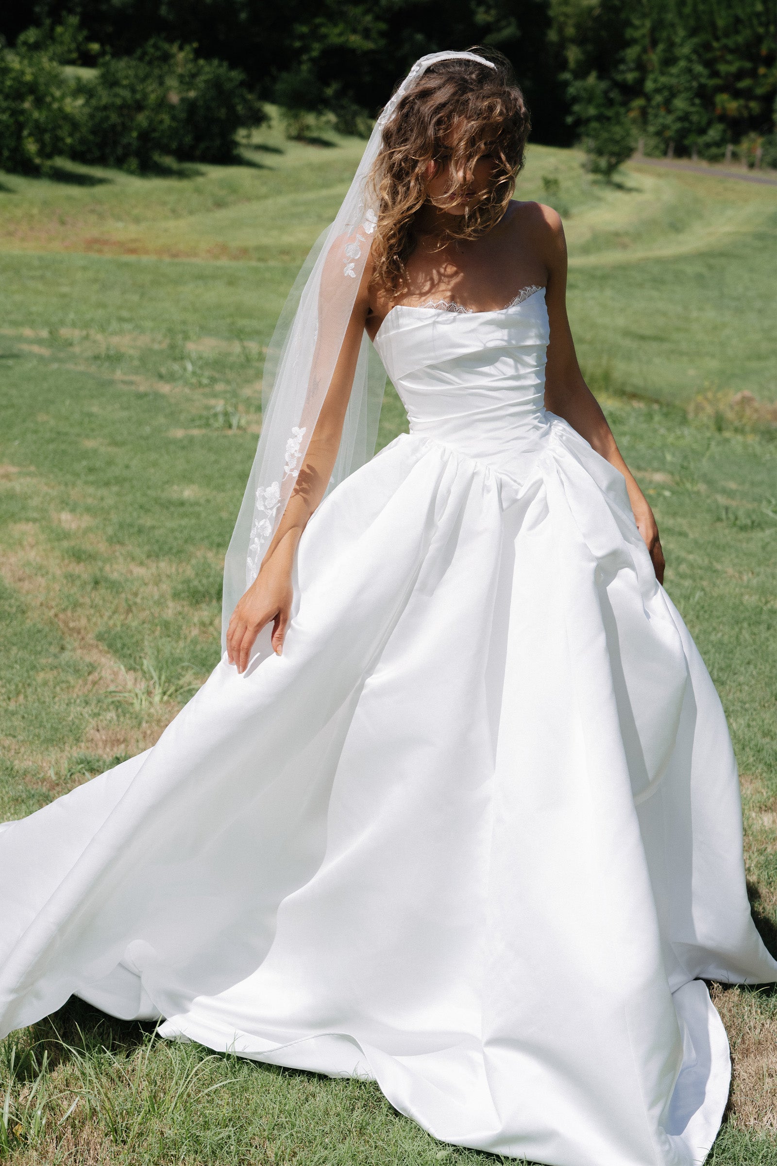 Woman wearing a satin A-line wedding dress_XS_