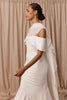 Woman in a wedding dress and sheer bridal cape
