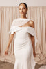 Woman in a wedding dress and sheer bridal cape
