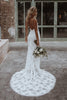 back of Clo wedding dress holding flowers