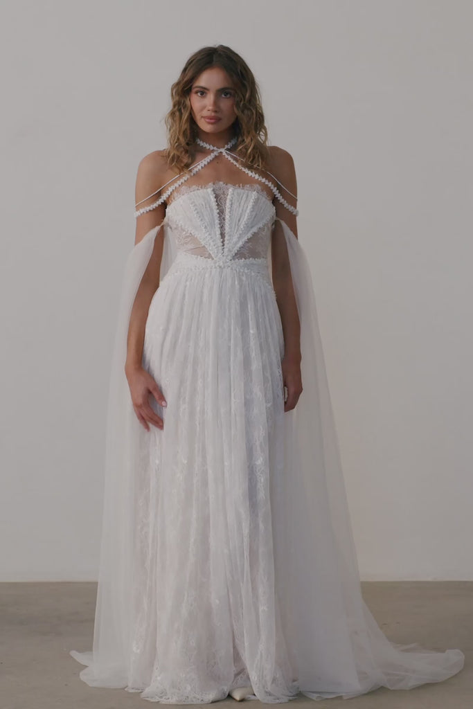 A woman wearing a strapless lace wedding dress
